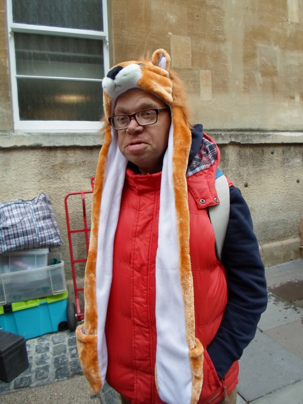 James trying on the latest style of hats